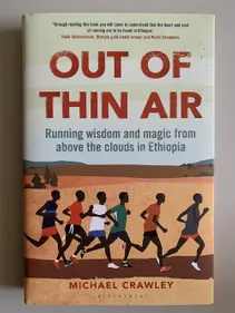 Book cover featuring runners in Ethiopia subtitled 'Running wisdom and magic from above the clouds in Ethiopia.