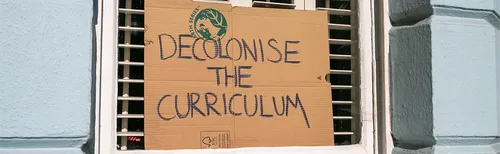 Decolonising the Curriculum sign in a window