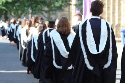 Student procession in graduation gowns