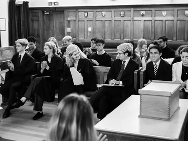 Our four finalists getting ready to present their cases in front of the student jury. Two advocates for the prosecution and two for the defence.