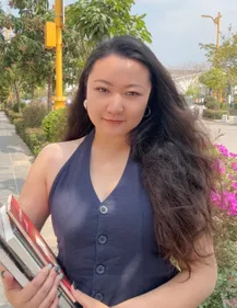 A portrait of a student on a street
