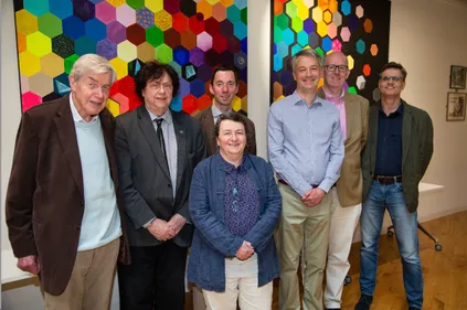 Group photo of (from left) Profs. Alan Martin, Martin Ward, guest speaker Dr Richard Bowman, Paula Chadwick, Matthew Jones, Ifan Hughes and Del Atkinson in front of the Ogden Centre West artwork
