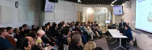 People sitting in a workshop
