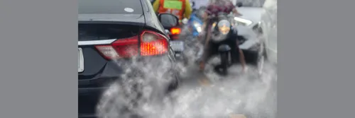 Carbon emissions emitted by a car on a busy road