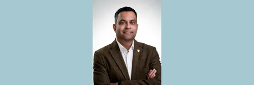 Professor Kieran Fernandes is pictured on a white background