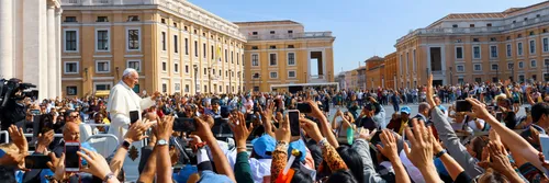 Pope Francis greeting crowds of people