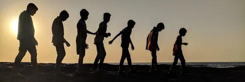 Silhouettes of a child growing through to an adult