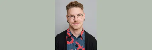 Dr Travis LaCroix is pictured against a plain background