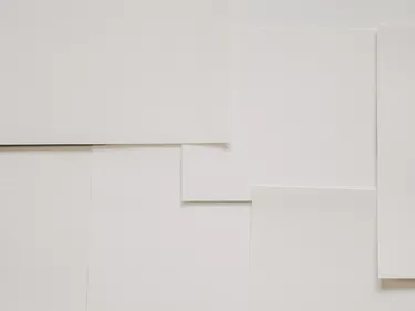 Multiple squares of plain white paper