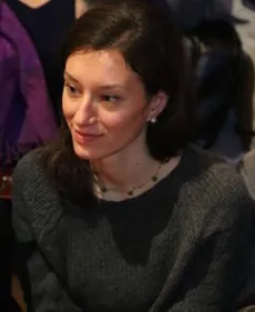 Profile picture of Marta Cenedese (a young medium-skinned woman with mid-length dark hair wearing a dark green knitted jumper)