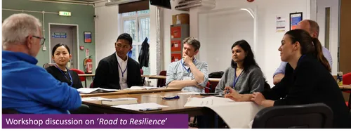 several academics sitting around a table