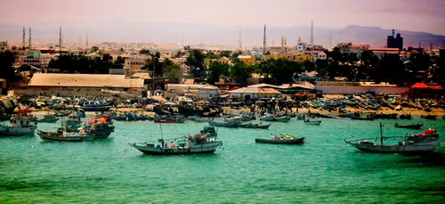 people in boats on a river in somalia