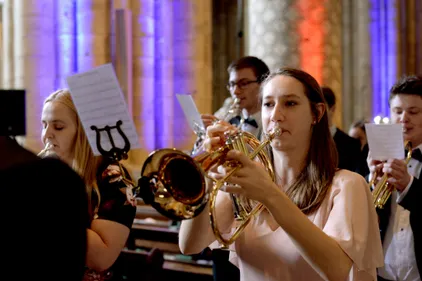 Students performing on brass instruments in the Cathedral