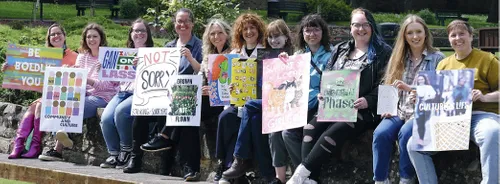 Members of Strike Women+ art collective, showing their artwork