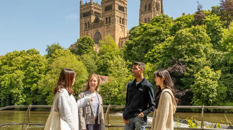 Students stand by river wear