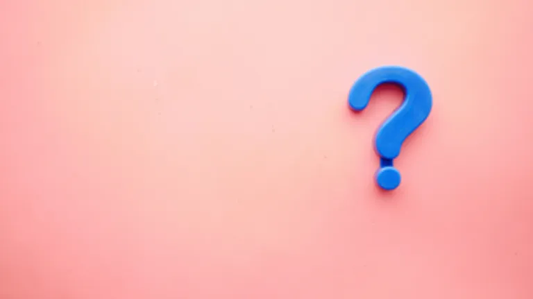 Blue question mark on a pink background
