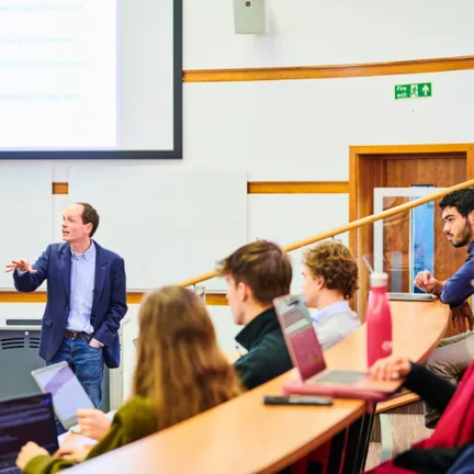 Students listening to lecturer in a lecture theatre