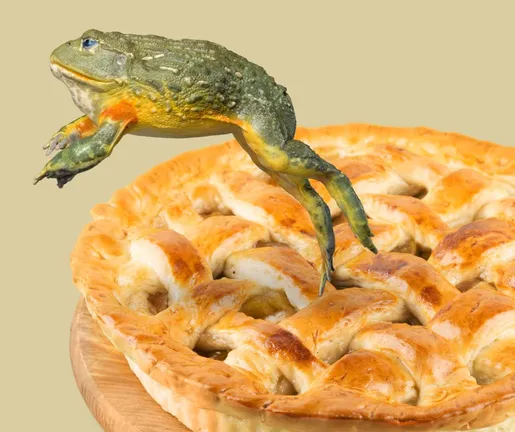 Frog jumping out of a pie