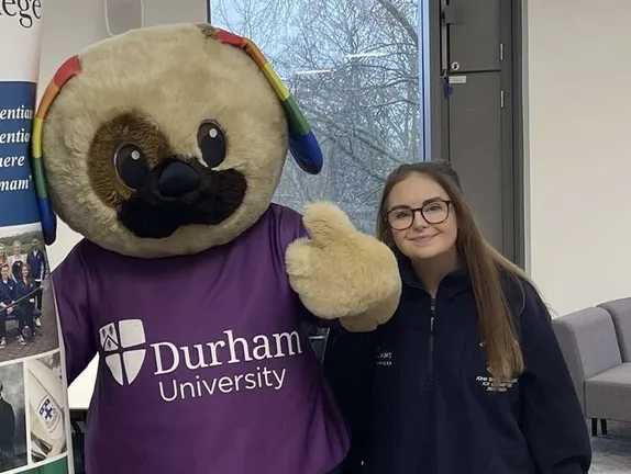 Student posing which Durham mascot
