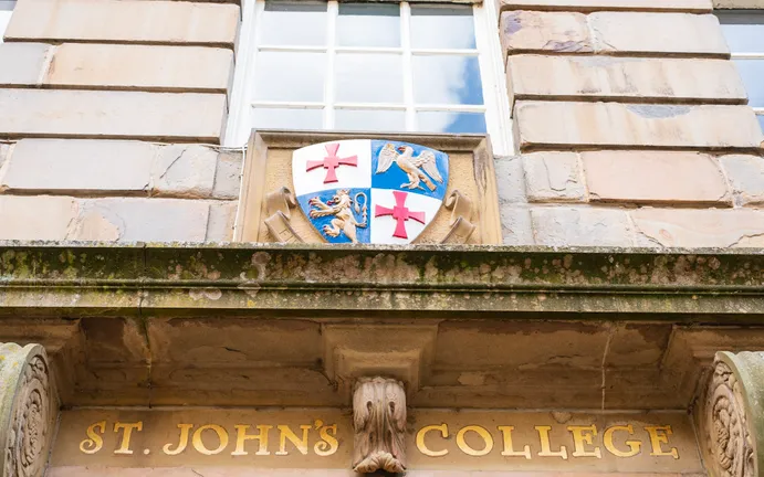 Golden lettering and crest outside St John’s College