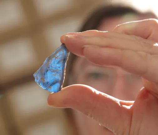 Someone holding a piece of stone