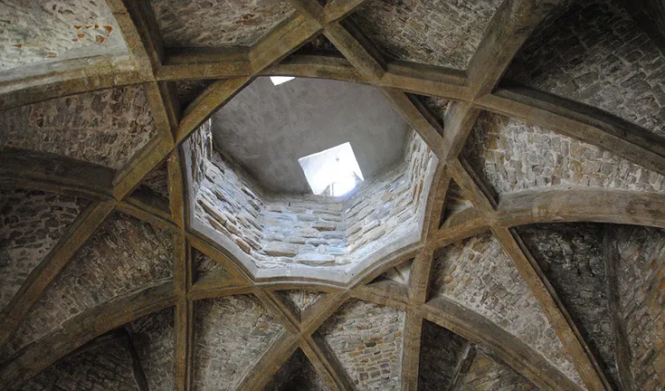 A vaulted medieval roof forming an 8-pointed star