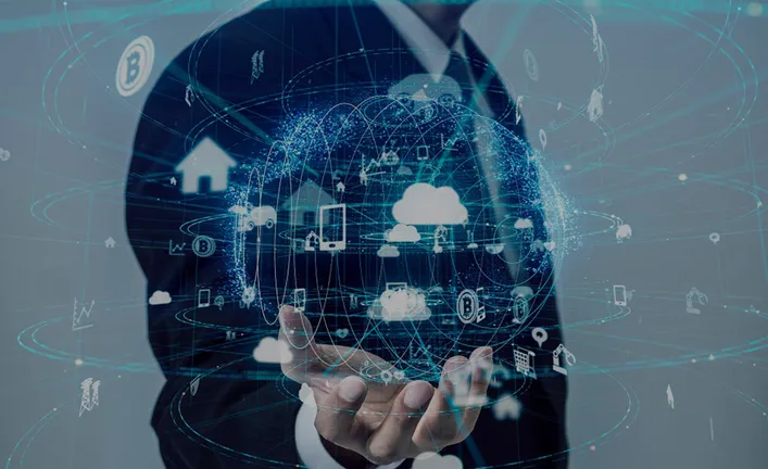 A man holding a projection of interconnected devices