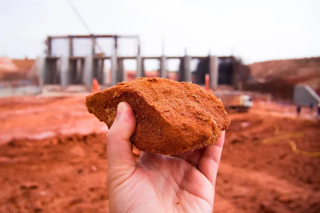 a hand holding soil