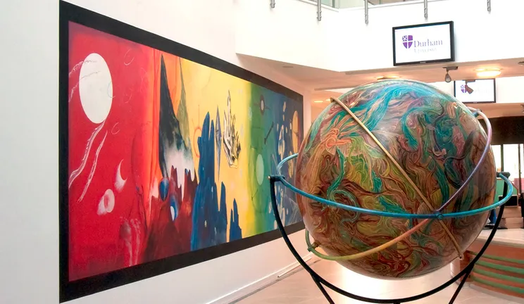 The Palatine Centre lobby with globe and artwork