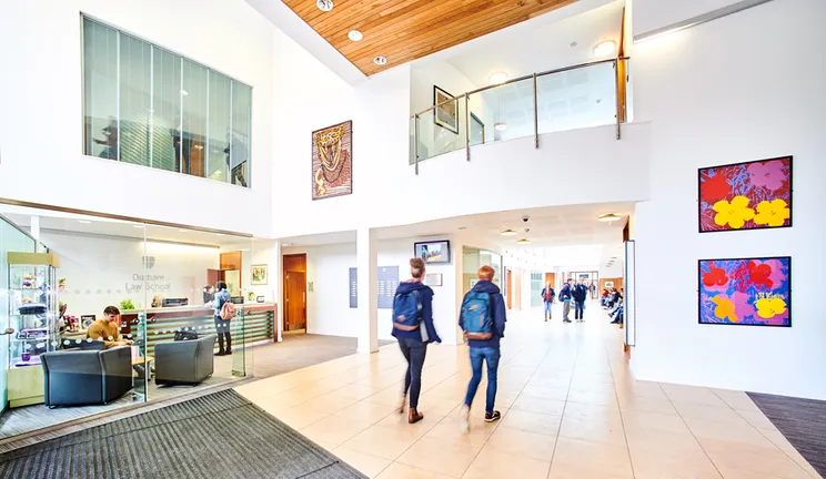 Busy entrance lobby of Durham Law School