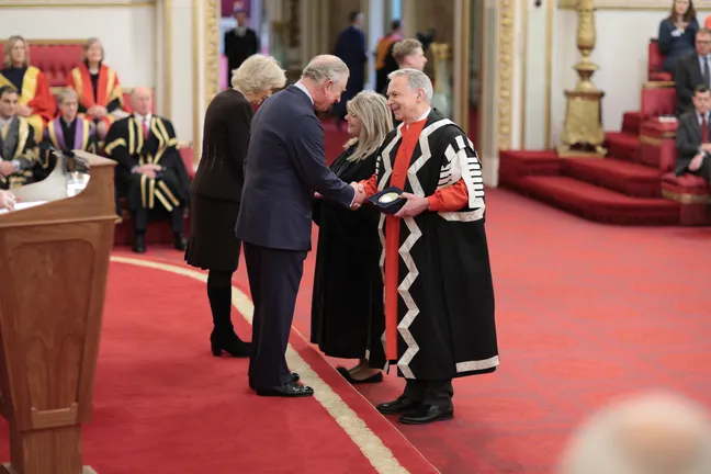 Receiving award at Buckingham Palace