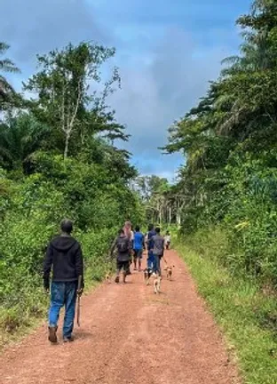 Men walking down a dusty track in Sierra Leone