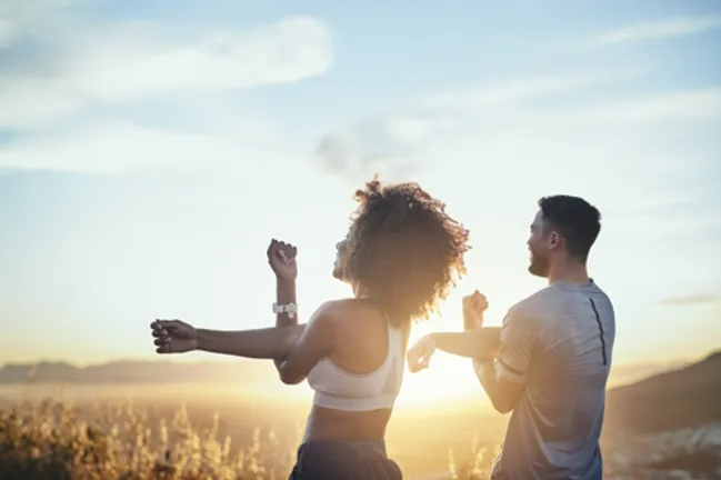 People stretching yoga stetching outdoors_courtesy of iStock