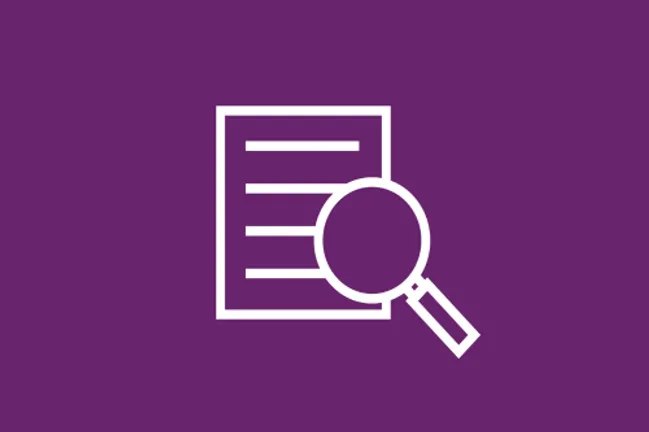 Magnifying glass over document icon