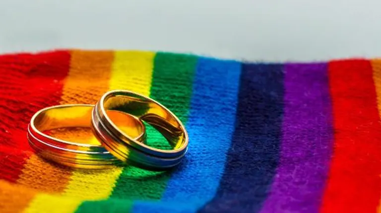 Wedding rings with rainbow flag