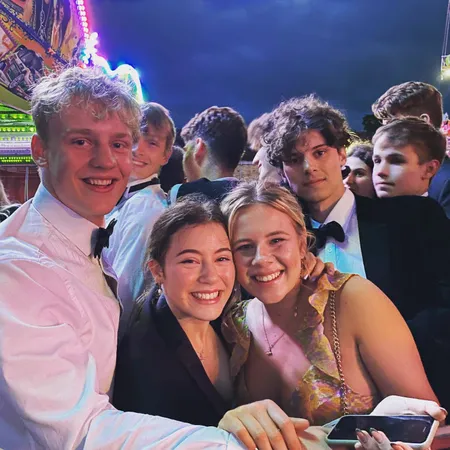 Four students from Van Mildert college pose during a formal event in black tie eveningwear