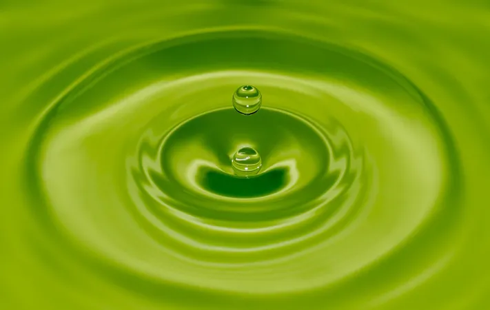 green drop of water