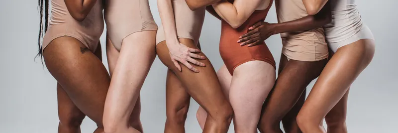 Diverse group of women in underwear in a line showing torso and upper legs only