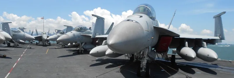 Military fighter jets on an aircraft carrier