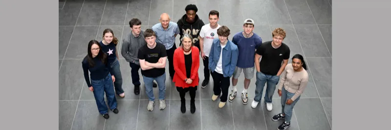 A group of students dressed casually stood with Chancellor Dr Fiona Hill