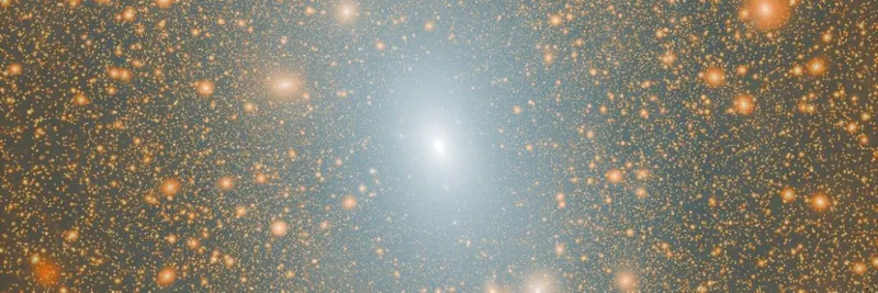 A simulation showing a bright white galaxy at the centre, surrounded by fainter galaxies, against a black backdrop.