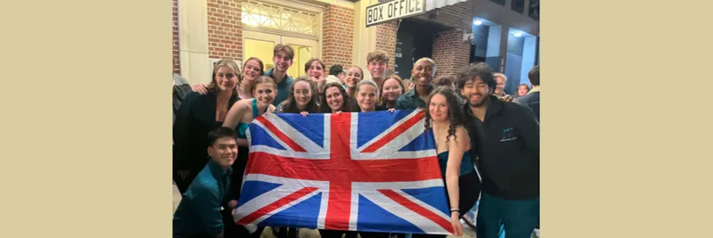 Northern Lights singers holding the UK flag at the 2024 ICCA in New York