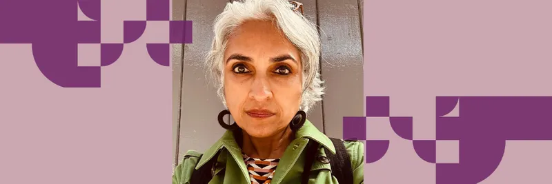 Professor Nayanika Mookherjee wearing a green top looking seriously at the camera