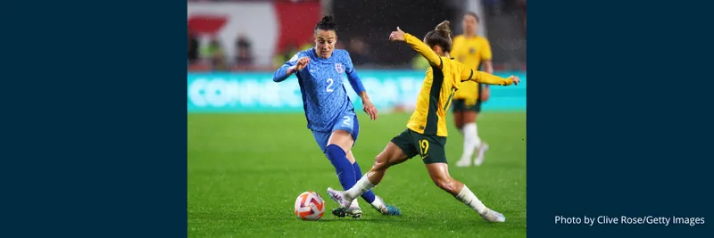 England player, Lucy Bronze runs with the ball whilst under pressure from Katrina Gorry of Australia during a friendly.