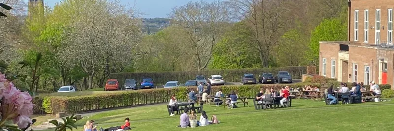 Students on lawn in front of college