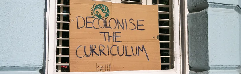 Decolonising the Curriculum sign in a window