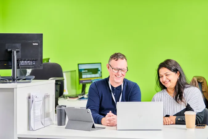 Colleagues sat working together