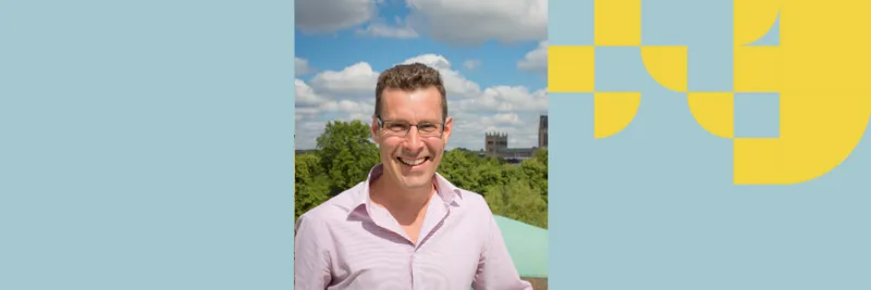 Professor Simon Cornish is pictured against the background of Durham Cathedral in the distance