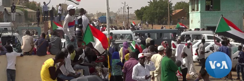 Protestors take to the streets in Sudan, waving Sudanese flags