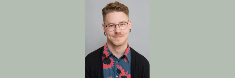 Dr Travis LaCroix is pictured against a plain background